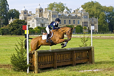 Horse and rider in the cross-country phase of an eventing competition, Charlton Park, Wiltshire, United Kingdom