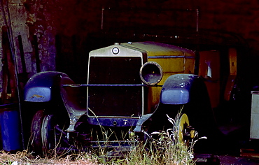 Vintage Fiat car awaiting restoration in a barn in Gloucestershire,England