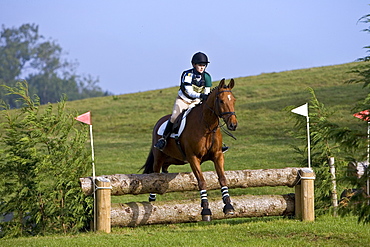 Event riding competing in cross-country phase of competition, Oxfordshire, United Kingdom