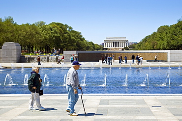 National World War II Memorial with Wall of Stars and Lincoln Memorial behind, Washington D.C, USA