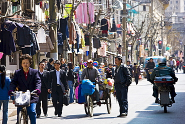 Busy street scene in Zi Zhong Road, old French Concession Quarter in Shanghai, China