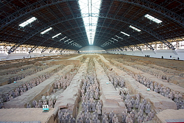 Tourists view infantry figures from the edge of Pit 1 at Qin Museum, exhibition halls of Terracotta Warriors, China