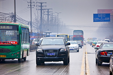 Imported Audi 4-wheel-drive vehicle in traffic on Xian main street, China