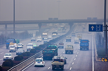 Traffic and pollution on motorway near the financial district of Xian, China