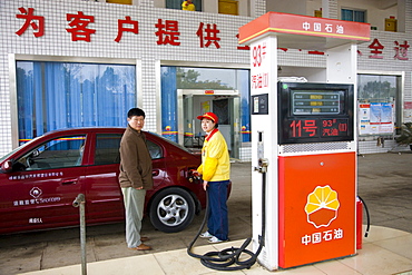 Filling up car at a petrol station, Yang shan near Guilin, China