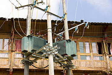 Telegraph pole with telephone and power lines installed in the mountain village of Ping An, Longsheng, near Guilin, China