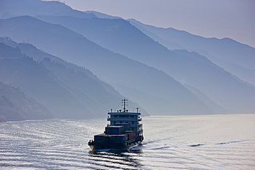 Transportation of cargo containers by boat in Three Gorges area, Yangtze River, China