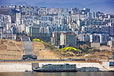 Victoria Line cruise ship by new town built to re-home communities as part of Three Gorges dam project, China