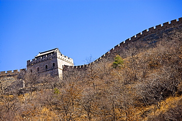 The ancient Great Wall of China snaking through mountains at Mutianyu, north of Beijing (formerly Peking)