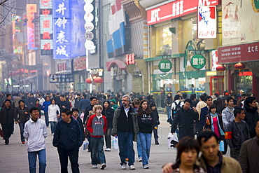 Crowded Wangfujing street and shops in Central Beijing, China