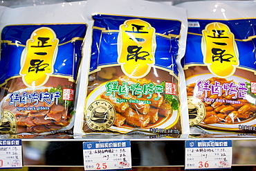 Bags of spicy duck necks, giblets and tongues in souvenir shop, Shanghai, China