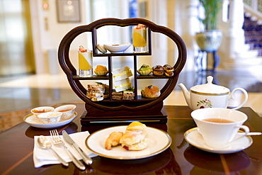 High tea at the Raffles Beijing Hotel, including sandwiches, cakes and scones, China