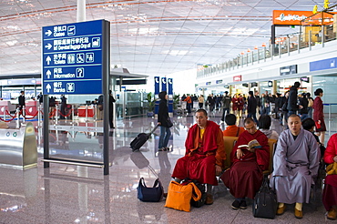 Buddhist monks in Terminal Three of Beijing Capital International Airport, China