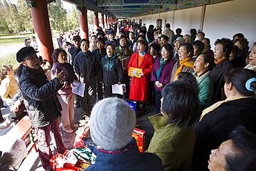 Singing group in the Ghost Corridor at park of the Temple of Heaven, Beijing, China