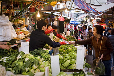 Fruit and vegetables on sale in old Chinese Soho food market in Graham Street, Central Hong Kong, China