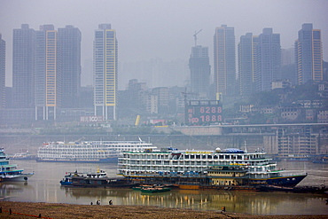 Pleasure cruisers from Victoria Line awaiting Western passengers for Yangtze River cruise, Chongqing, China