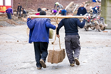 Men at work building new tourist centre at Dazu Rock Carvings, Mount Baoding, Chongqing, China