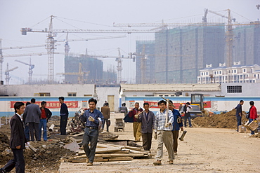 Workmen on a housing development in Yichang, China