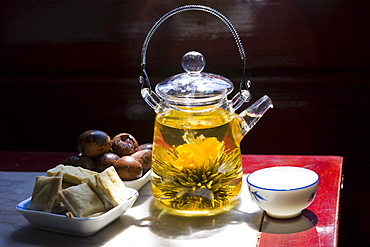 Flower infused tea and traditional snacks in the Huxinting Teahouse, Yu Garden Bazaar Market, Shanghai, China