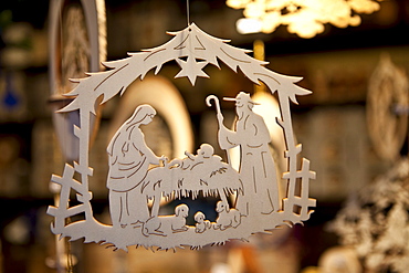 Wooden carved hanging ornaments at Christmas market, Winter Wonderland, in Hyde Park, London