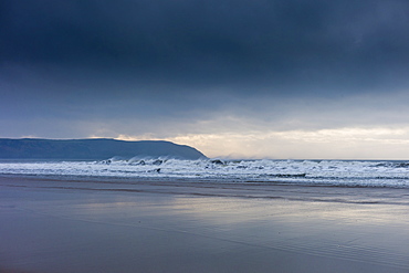 Waves crashing onto the beach at Woolacombe, North Devon, UK