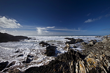 Waves lapping onto the beach at Watersmeet Bay near Woolacombe, North Devon, UK