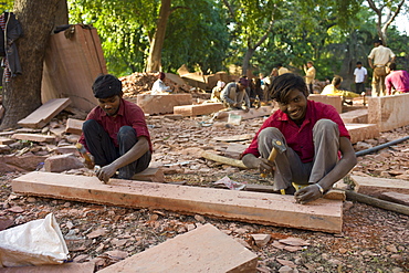 Stonemasons using traditional manual skills at stone workshop at Humayuns Tomb,  in New Delhi, India