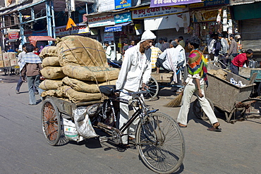 Porters at Khari Baoli spice and dried foods market, Old Delhi, India