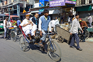 Rickshaw with passengers at Khari Baoli in Old Delhi, India