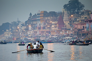 Traditional scenes of tourists on on River Ganges at Varanasi, Benares, Northern India