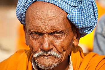 Hindu pilgrim with turban at Dashashwamedh Ghat in holy city of Varanasi, Benares, India