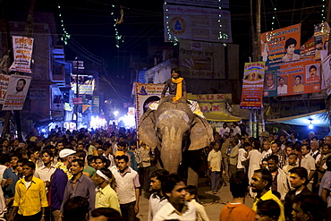 Ceremonial elephant moves through crowd at Festival of Shivaratri in the streets of the holy city of Varanasi, Benares, Northern India