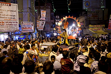 Lord Shiva and Parwati characters parade through crowd at Festival of Shivaratri in the holy city of Varanasi, Benares, Northern India