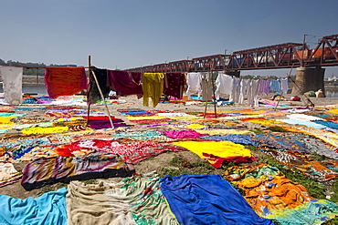 Saris and other laundry drying on the banks of River Yamuna at Agra, India