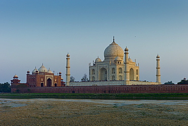 The Taj Mahal North Side viewed across Yamuna River at sunset , India