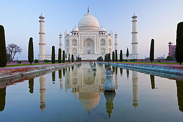 The Taj Mahal mausoleum southern view with reflecting pool and cypress trees, Uttar Pradesh, India