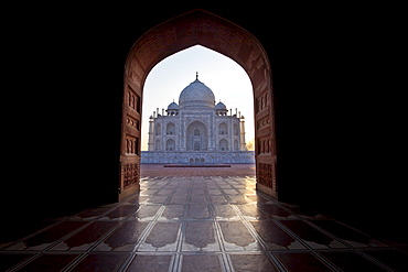 The Taj Mahal mausoleum western view (viewed from Taj Mahal Mosque with its prayer mat floor tiles) at dawn, Uttar Pradesh, India