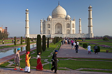 Asian tourists at The Taj Mahal mausoleum southern view Uttar Pradesh, India