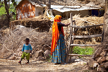 Indian woman villager and child at her smallholding farm at Kutalpura Village in Rajasthan, Northern India