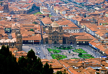 Young people gather in Plaza de Armas  square by the fountain in Cuzco, the ancient capital of the Inca Empire, Peru, South America