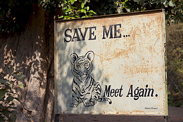 Save Tiger poster at exit of Ranthambhore National Park tiger reserve, Rajasthan, Northern India