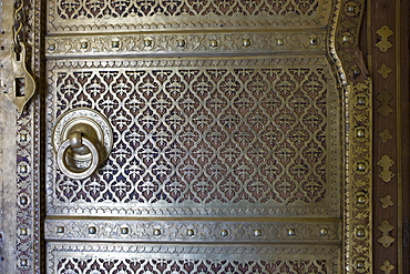 Brass panelling of door to the harem Zenana Deorhi at The Maharaja of Jaipur's Moon Palace in Jaipur, Rajasthan, India