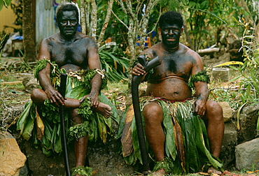 Traditional Fijian Warrior Guards wearing grass skirts and face paints, Fiji, South Pacific