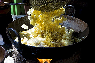 Deep-fried snack foods, potato chips, on sale in old town market Udaipur, Rajasthan, Western India,