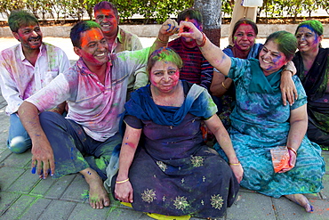 Indian people celebrating annual Hindu Holi festival of colours with powder paints in Marine Drive, Mumbai, formerly Bombay, India