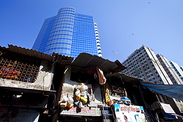 Essar House office development for Essar Group by slums in Mahalaxmi area of Mumbai, India shows contrast of rich and poor