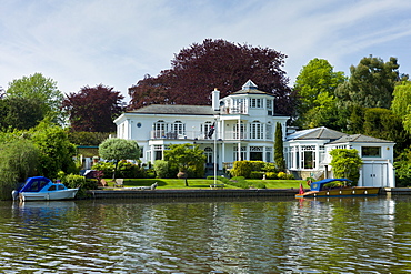 Luxury riverside houses on the banks of the River Thames in Berkshire,  UK