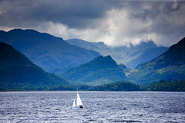 Sailing yacht on Derwent Water at Friar's Crag near Keswick in the Lake District National Park, Cumbria, UK