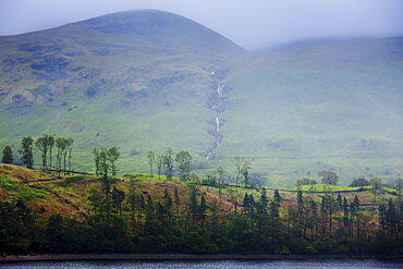 Mountain stream and Thirlmere Lake reservoir in the Lake District National Park, Cumbria, UK