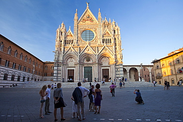 Tourists visit Il Duomo di Siena, the Cathedral of Siena, Italy